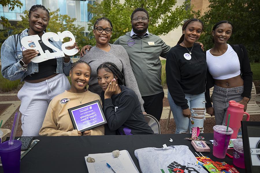 Several members of the Black Student Union group together for a photo.